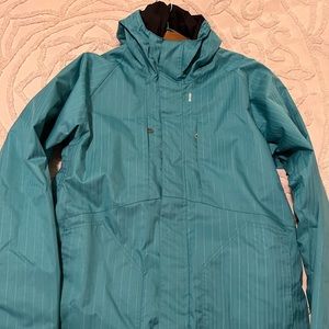 Large Bond ski / snowboarding winter coat with powder skirt.